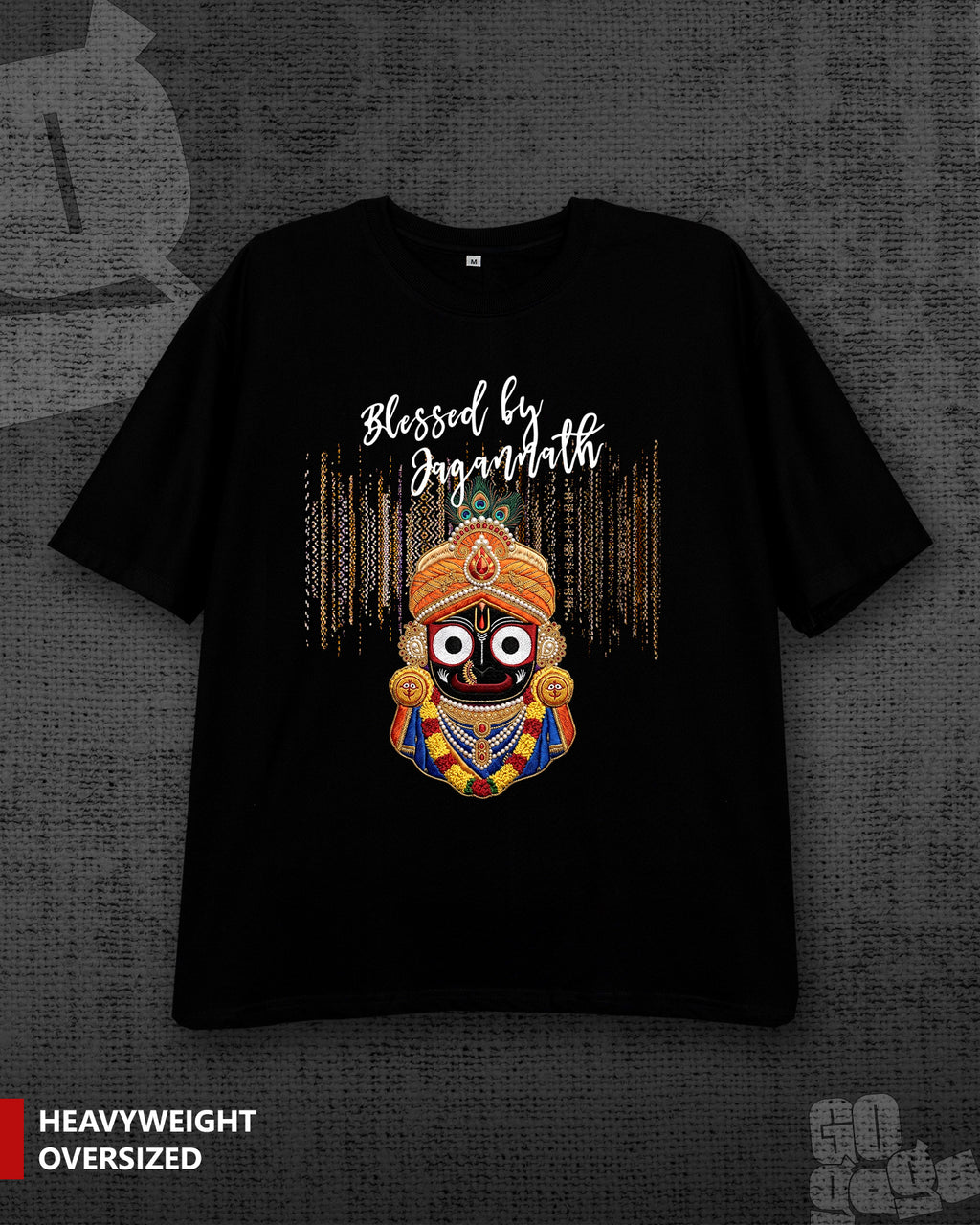 A black oversized graphic t-shirt featuring a colorful illustration of a Hindu deity and the text 'Blessed by Jagannath' on the front, displayed against a dark textured background with a 'HEAVYWEIGHT OVERSIZED' label in the bottom left corner.