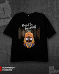A black oversized graphic t-shirt featuring a colorful illustration of a Hindu deity and the text 'Blessed by Jagannath' on the front, displayed against a dark textured background with a 'HEAVYWEIGHT OVERSIZED' label in the bottom left corner.